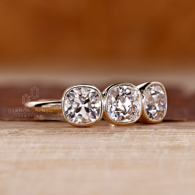Cushion old european diamond ring with open gallery design.
