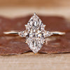 Three stone marquise diamond ring with pear side stones.