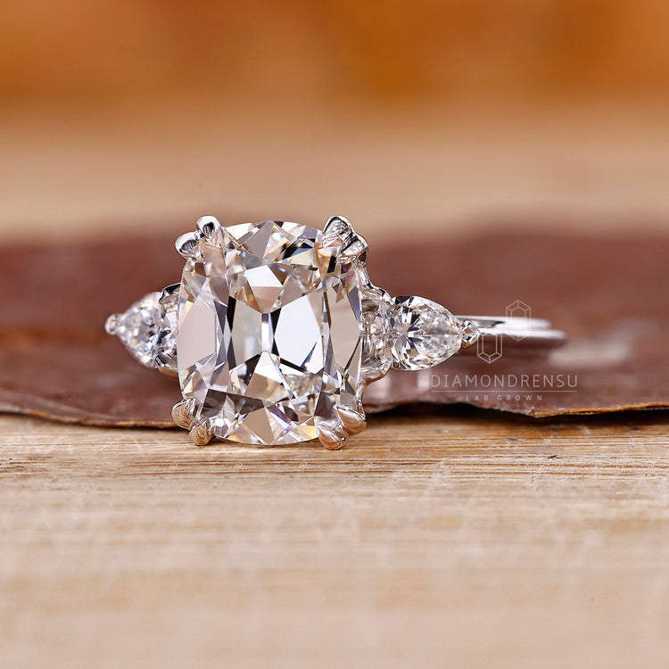 Handmade three diamond ring with cushion old mine center by Diamondrensu.