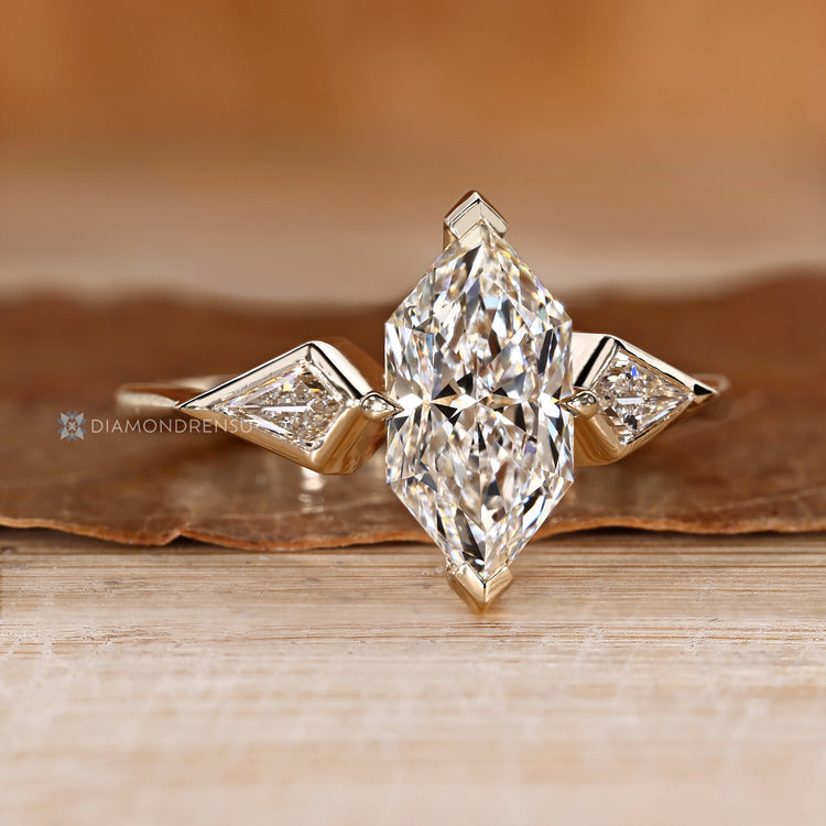 Dutch marquise diamond ring with kite side stones.
