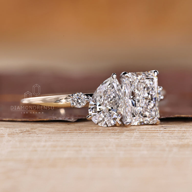 Handmade ring with pear and radiant cut diamonds in two stone style.