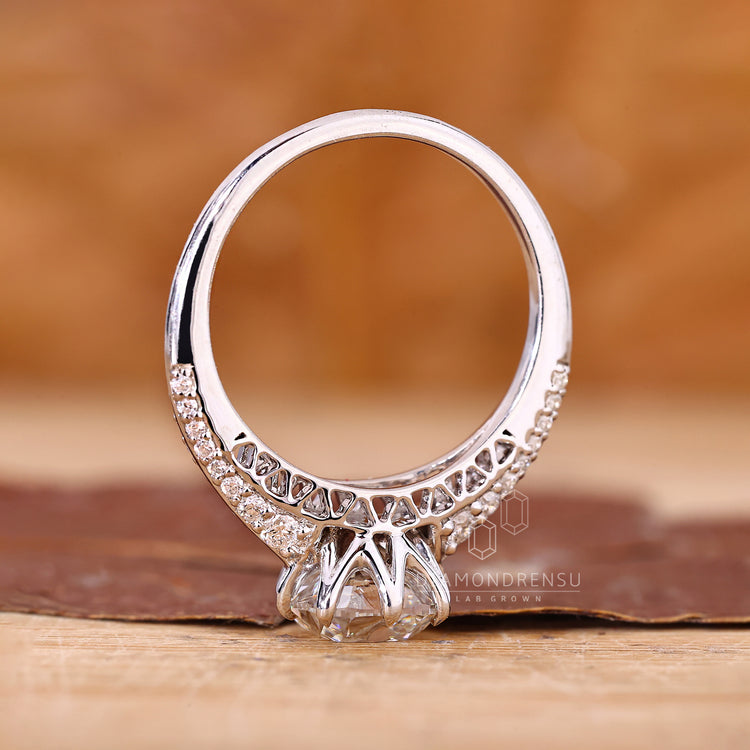 IGI certified cushion old european diamond ring with tulip design.
