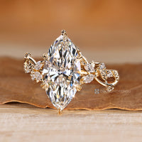 Six leaf style prong setting on a marquise cut ring.