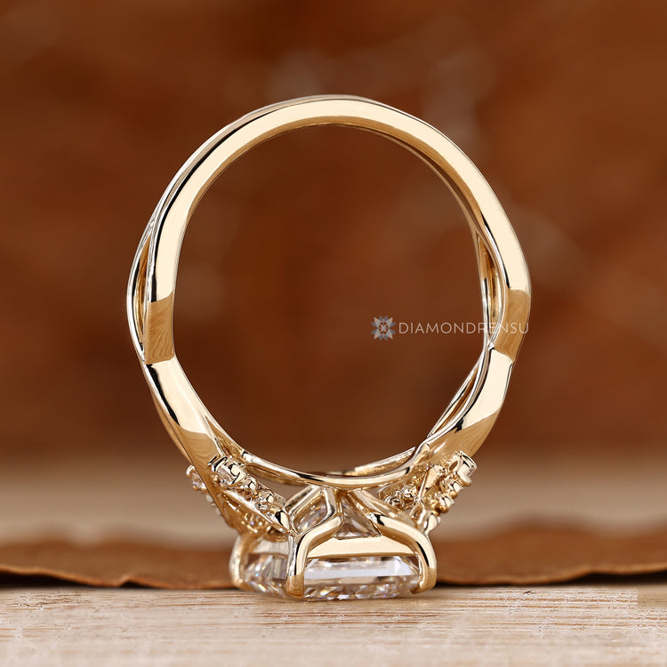 Nature inspired diamond ring with a princess cut center stone.