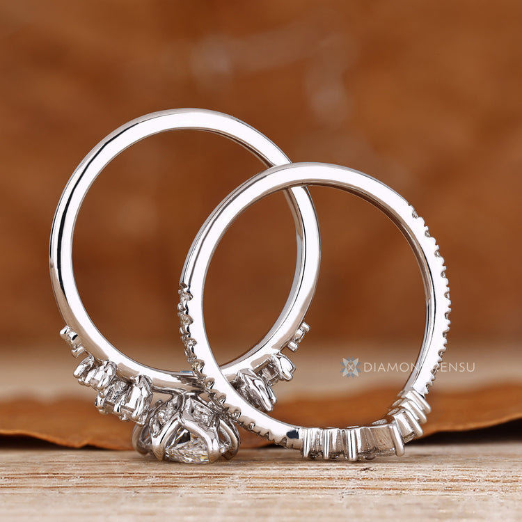 Handmade marquise ring with muse setting and side stones.