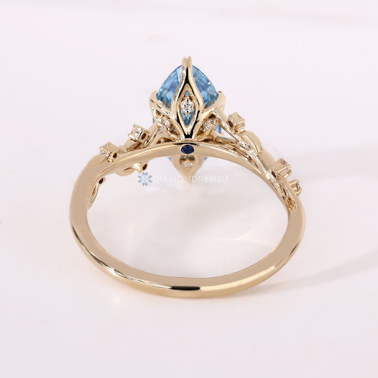 IGI certified blue marquise engagement ring.