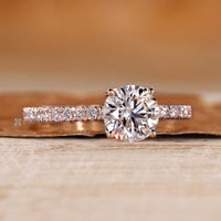 Four prong setting on a round cut diamond ring.
