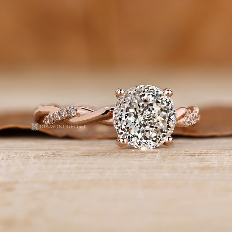Four prong setting secures the center diamond.