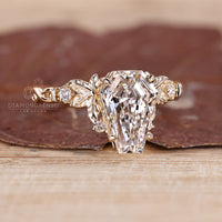 IGI certified coffin cut diamond ring with side stone accents.