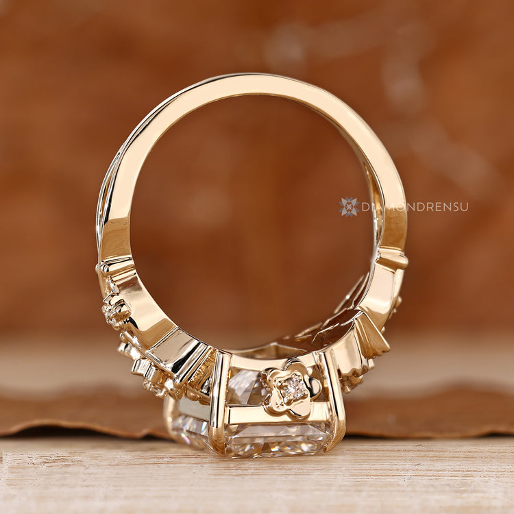 Nature inspired radiant engagement ring with round side stones.