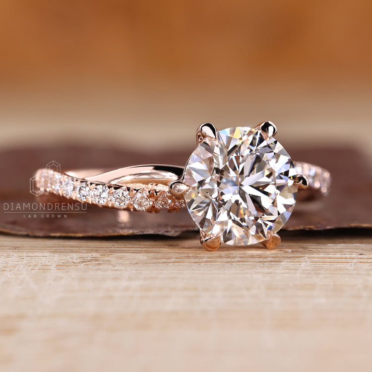 Handmade round diamond engagement ring with twisted shank design.