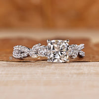 Cluster setting complements the marquise and round side stones.