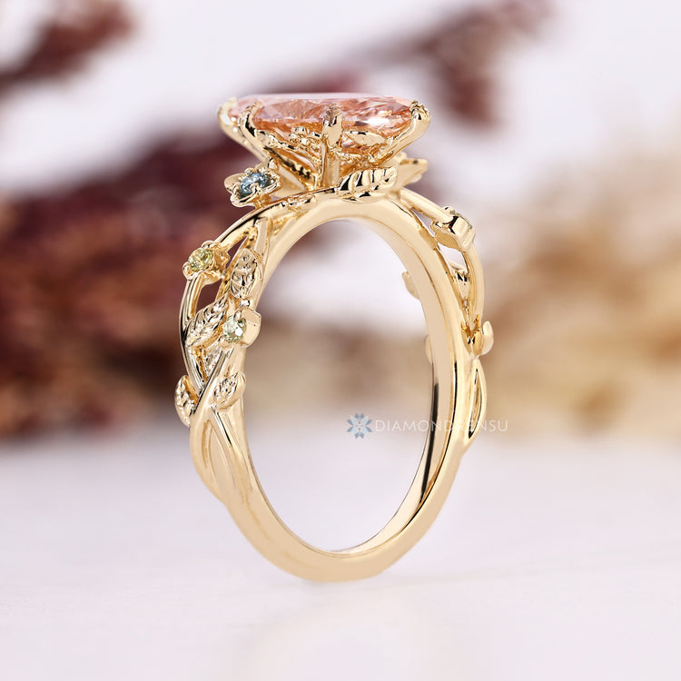 Marquise diamond ring with hidden flower and leaf details.