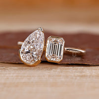 Bezel and v prong toi et moi diamond ring.