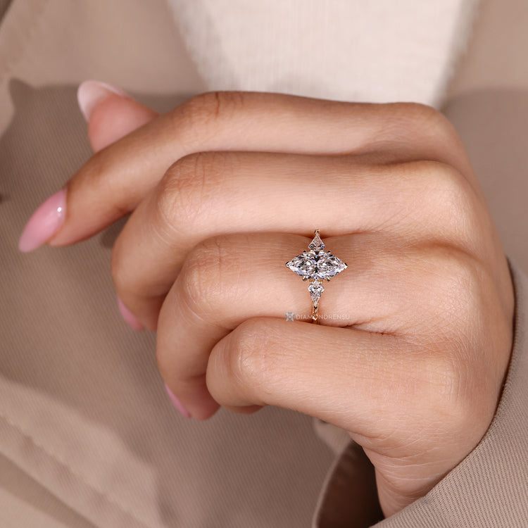 Lab grown diamond with marquise center stone and kite side stones.