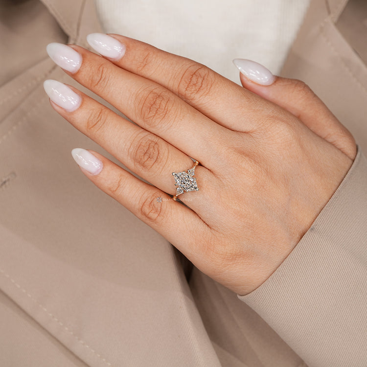 Trilogy diamond ring with a tulip setting and tapered shank.