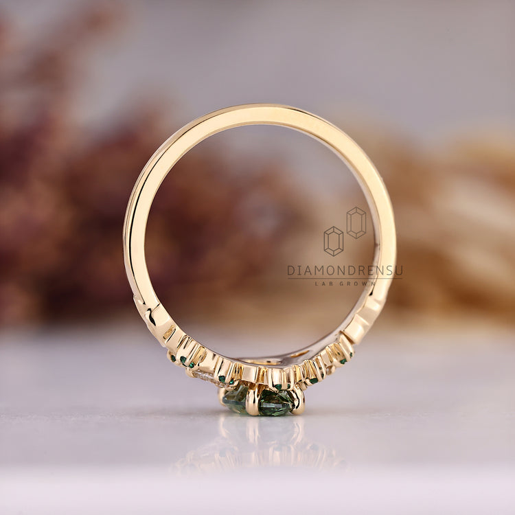 Marquise engagement ring with cluster setting and side stone accents.