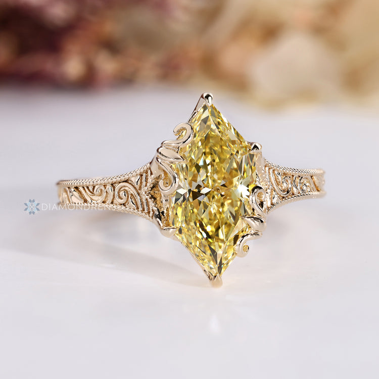 Art Deco style adds detail to this Dutch marquise diamond ring.