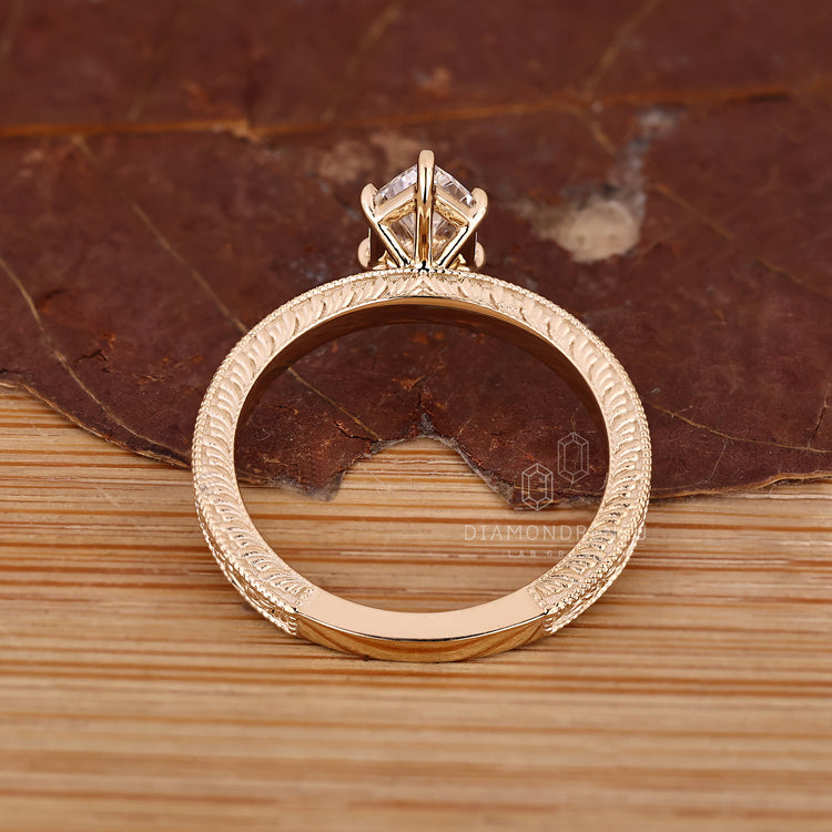 Solitaire Dutch marquise ring with vintage inspired wave design.