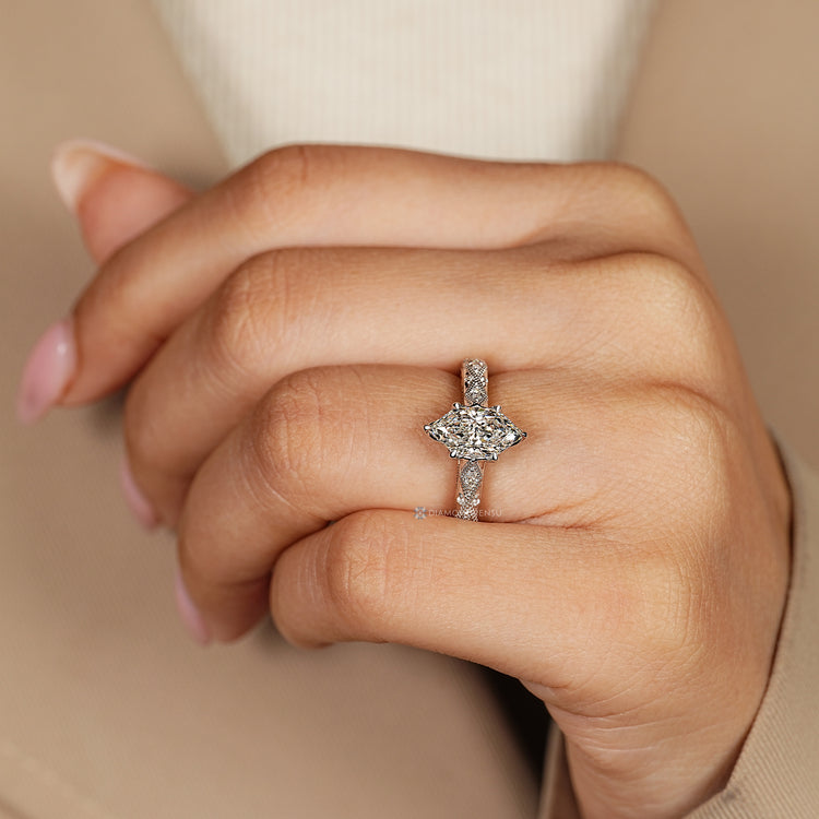 Dutch marquise ring with a cathedral setting and six claw prongs.