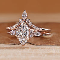 Marquise and round band complements the curvy band.
