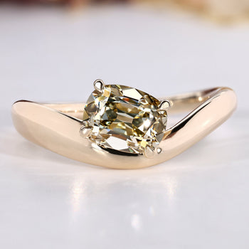 Cushion old mine cut ring in light yellow with solitaire style.