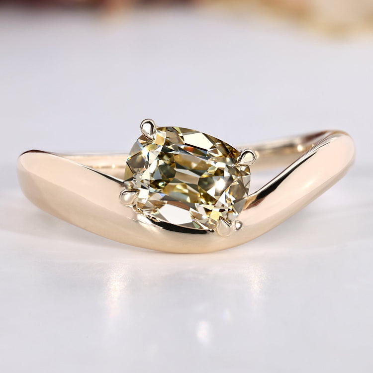Cushion old mine cut ring in light yellow with solitaire style.