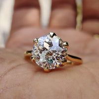 Jubilee cut moissanite ring with a gold shine.
