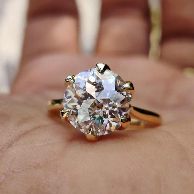 Jubilee cut moissanite ring with a gold shine.
