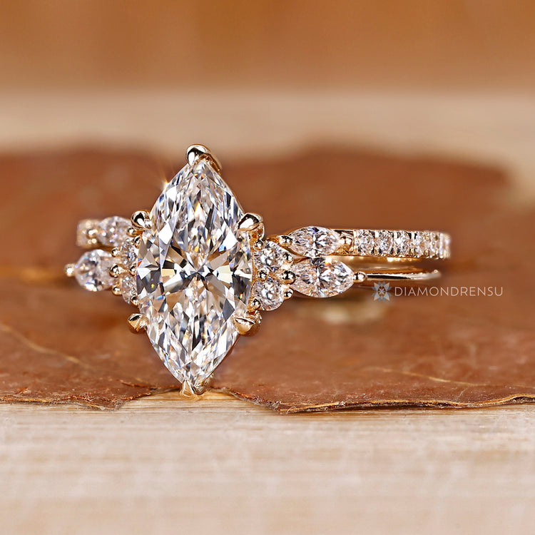 Three quarter eternity band complements the marquise ring wedding band.