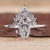 Coffin shaped engagement ring with vintage style and half halo design.