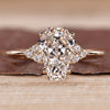 Coffin cut diamond ring with round side stones and seven stone style.