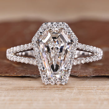 Split shank diamond ring with coffin center stone and halo style.