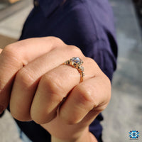 4 claw prong setting secures a round rose cut moissanite.
