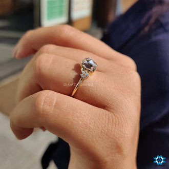 Moissanite engagement ring with a classic round rose cut design.
