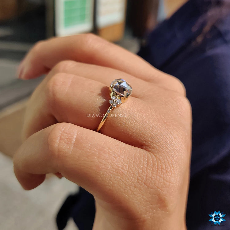 Moissanite engagement ring with a classic round rose cut design.
