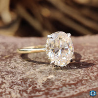 Simple oval cut moissanite engagement ring.