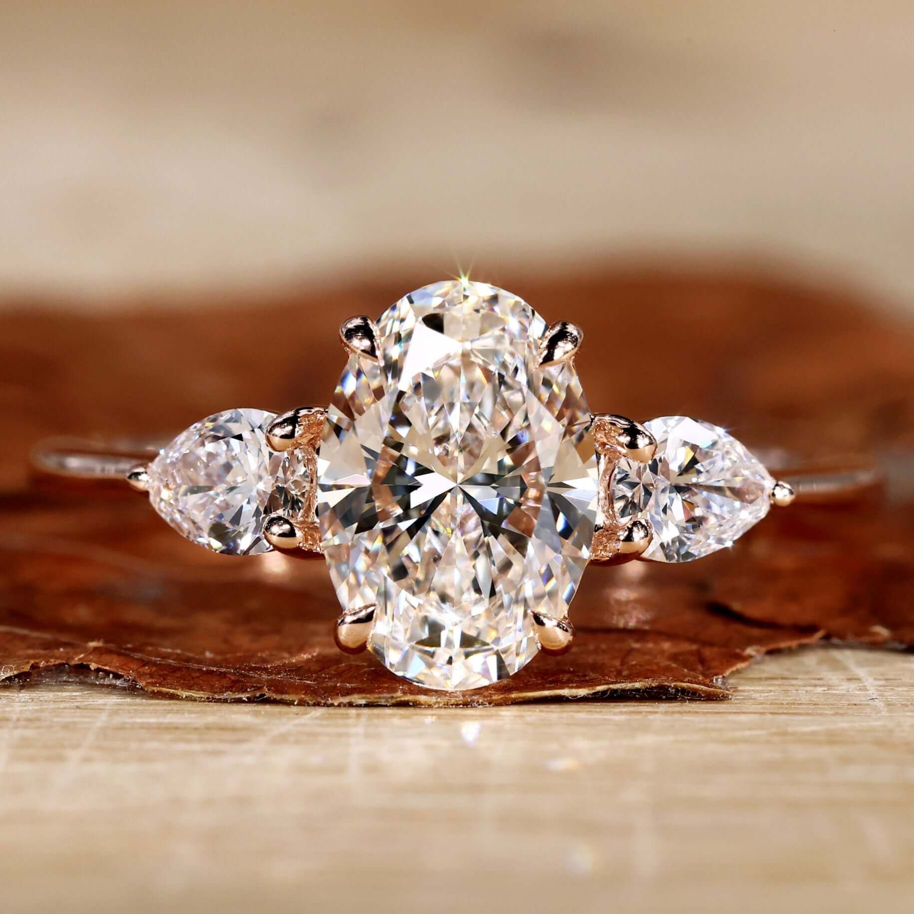 Ring R'side Three Stone Oval Engagement Ring with Pear Side Stones
