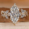 Nature inspired engagement ring with a marquise center stone.