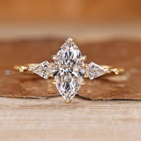 Art Deco diamond ring with marquise center stone and kite side stones.