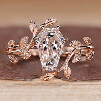 Coffin diamond ring with nature inspired style and solitaire design.