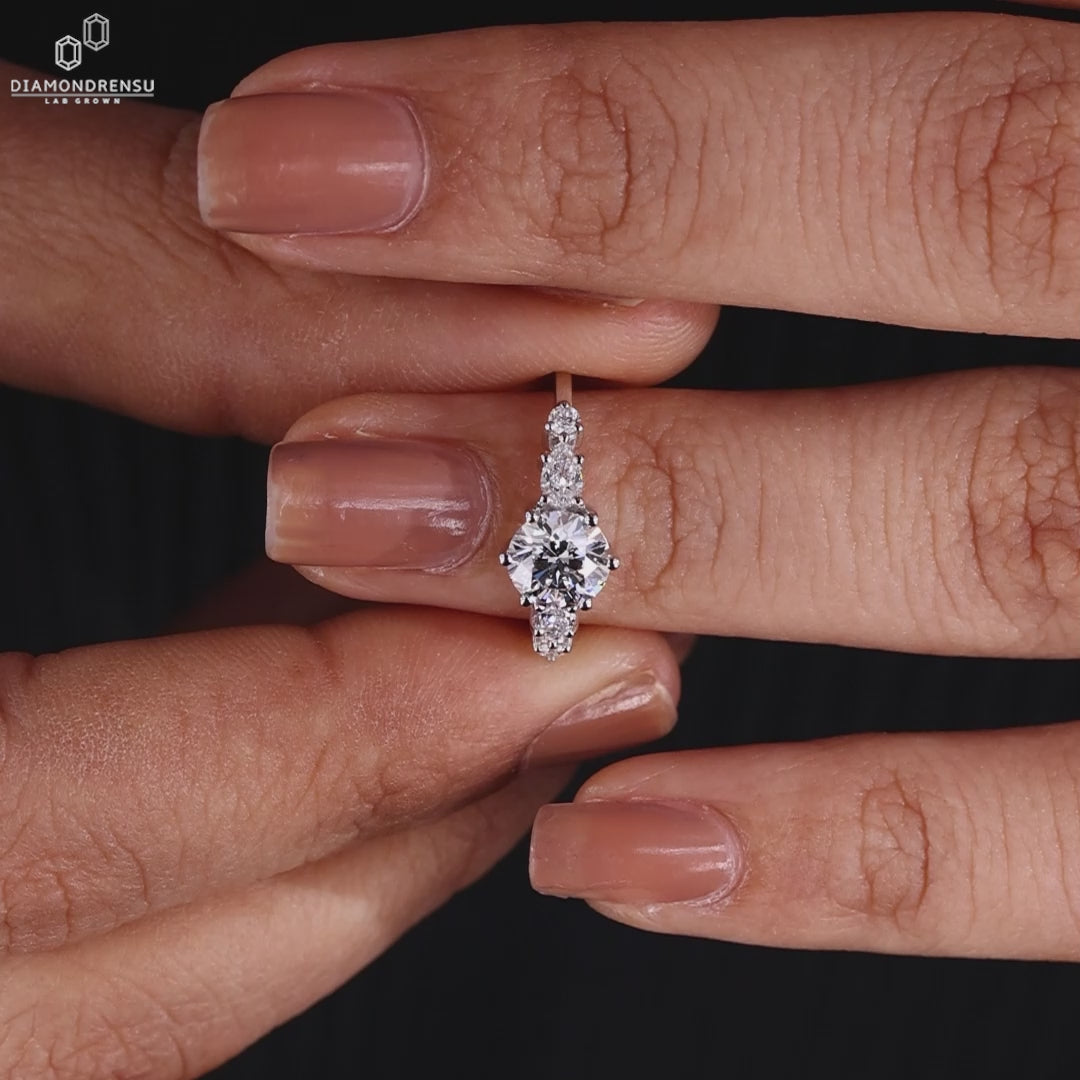 Sparkling round diamond engagement ring on a velvet box, showcasing classic beauty.