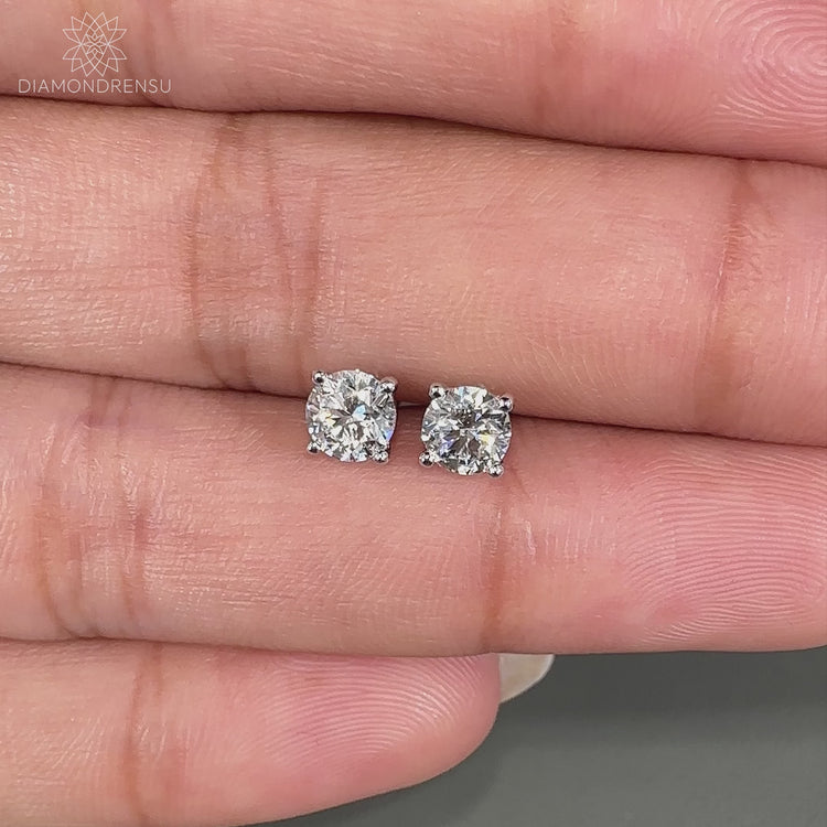 Stunning 0.70 TCW round diamond stud earrings for timeless elegance.
