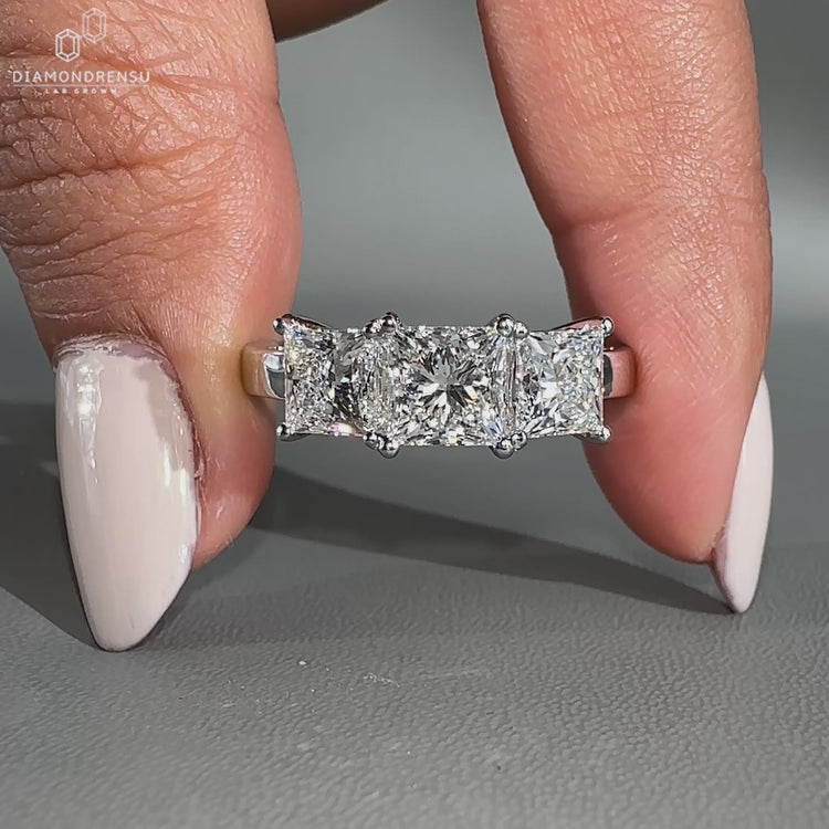 3 stone princess cut diamond ring with a sleek prong setting.
