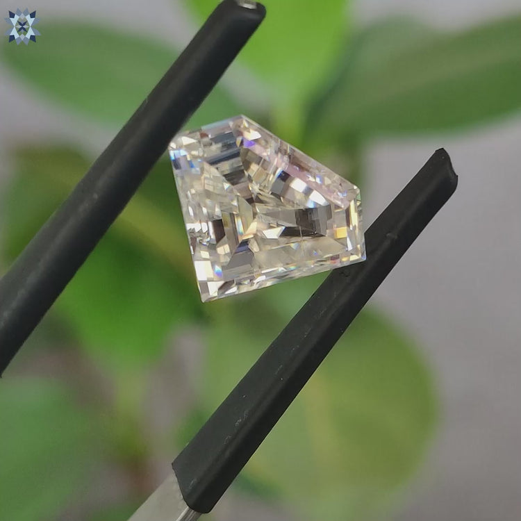 Loose moissanite stone glowing near colorless moissanite.
