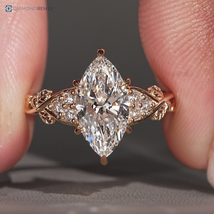 Lab grown marquise diamond ring with seven stone design.