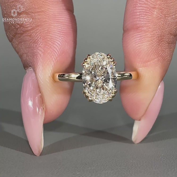 Lab grown oval diamond ring with round hidden diamonds.
