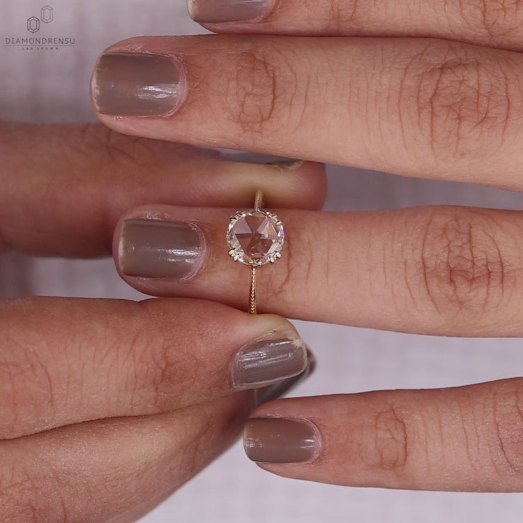 Solitaire Diamond Ring featuring a round rose cut diamond.
