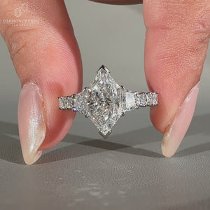 Trapezoid brilliant cut ring with custom pave shared prong band
