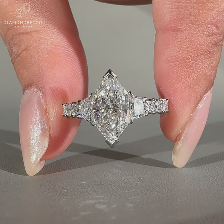 Trapezoid brilliant cut ring with custom pave shared prong band
